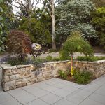 Landscaped Frontyard with Stone Wall and Feature