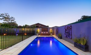 Pool with backlit screen and outdoor lighting