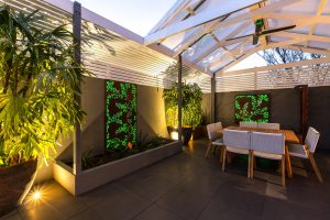 Outdoor Living Area with Backlit Screens and Outdoor Lighting